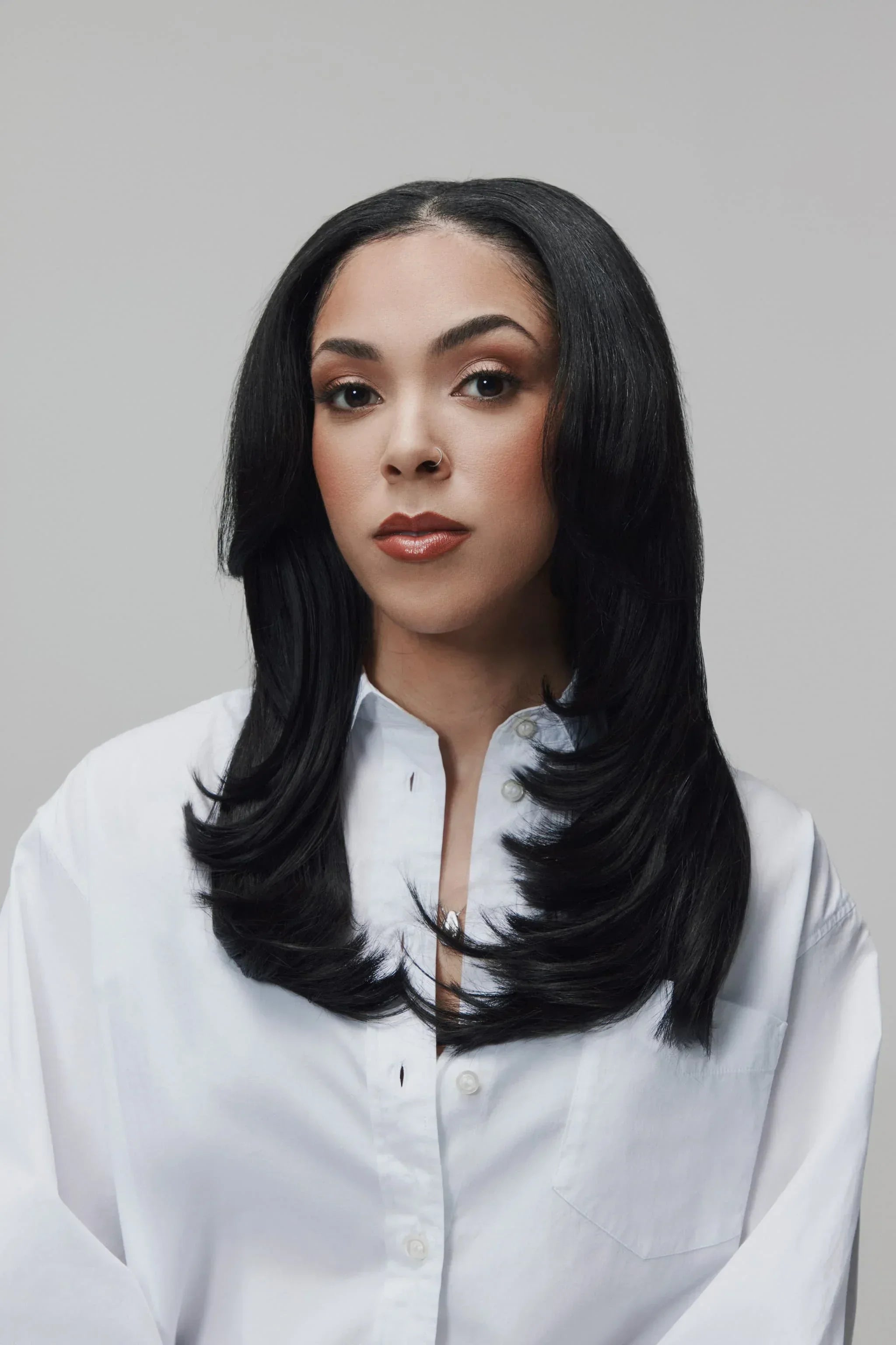 Front view of model wearing 90s Fine by SOWN raw Vietnamese hair with a sleek, straight finish