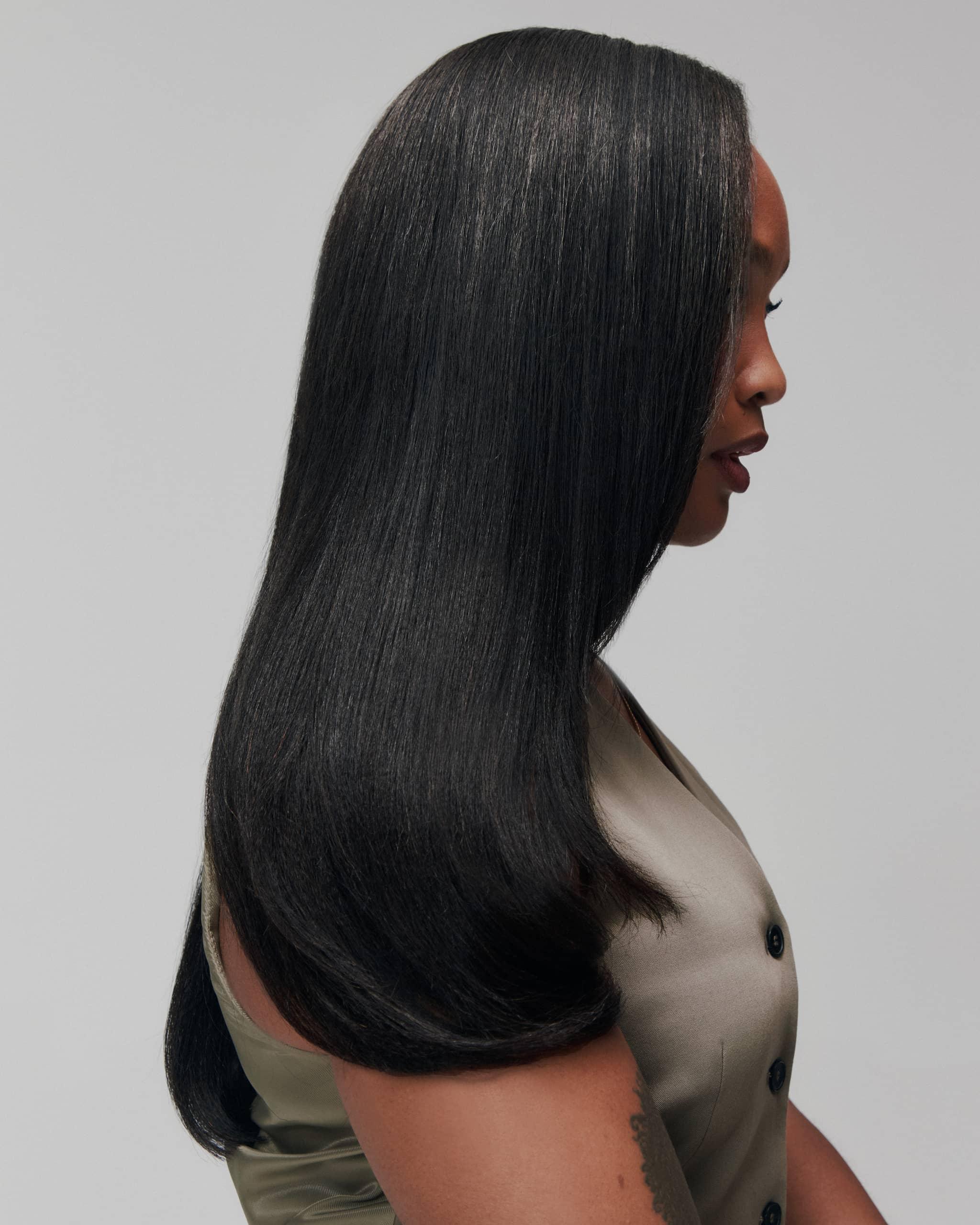 Side profile of model wearing Fine Babe by SOWN. Refined Burmese hair with a textured silk press finish, blending effortlessly for Type 4 girls
