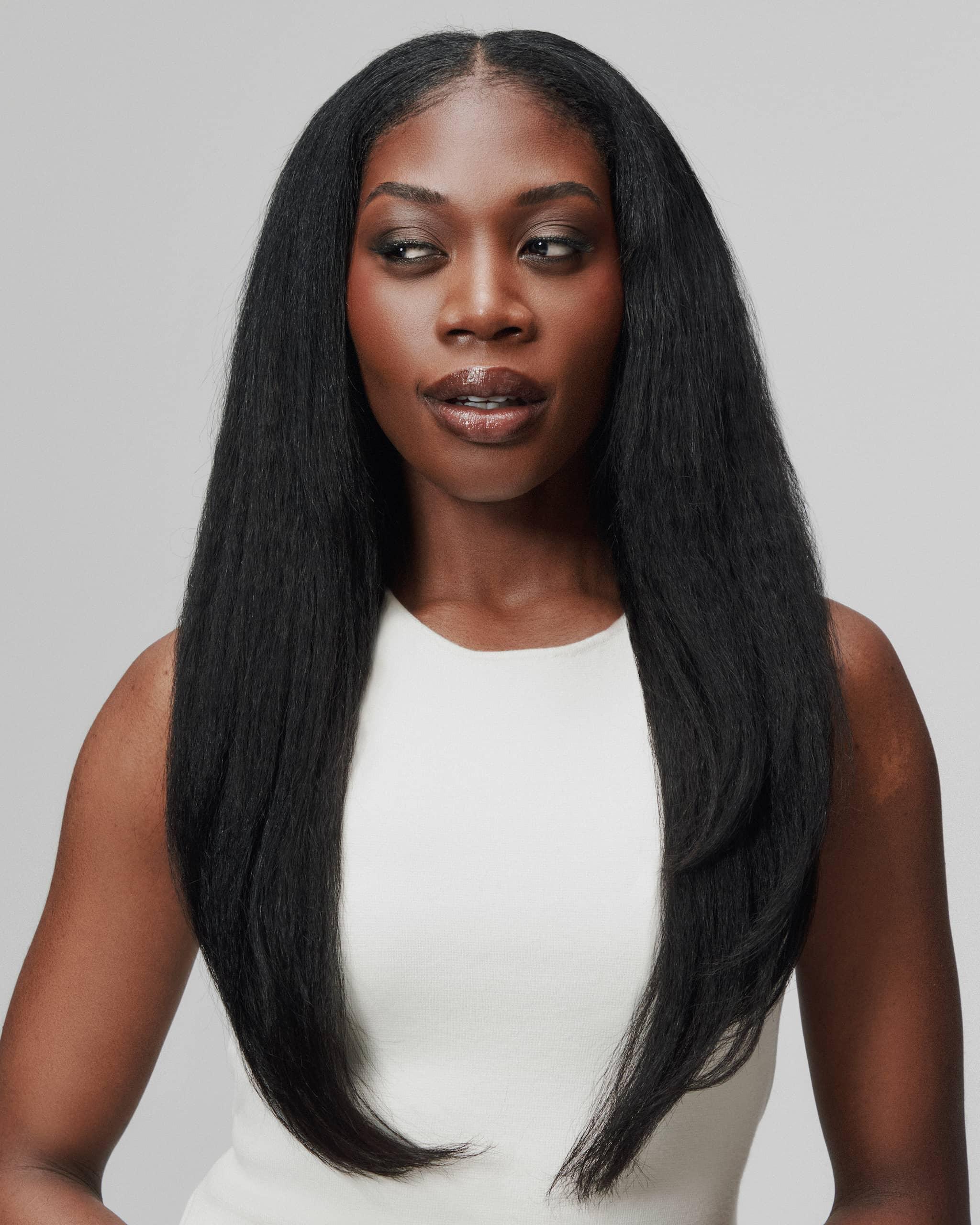 Front view of model wearing Star Girl by SOWN refined Cambodian blowout texture for Type 4 hair